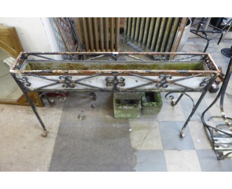 A wrought iron planter 