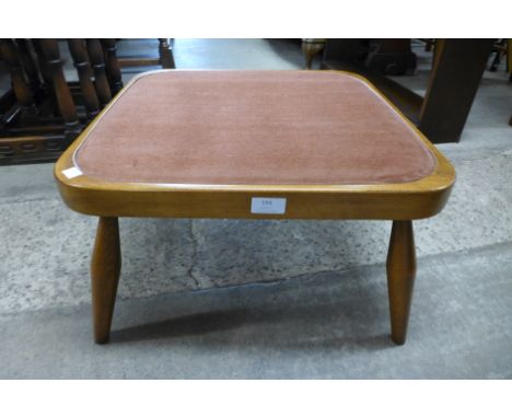 An Ercol Golden Dawn footstool 