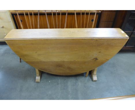 An Ercol Blonde drop-leaf table 