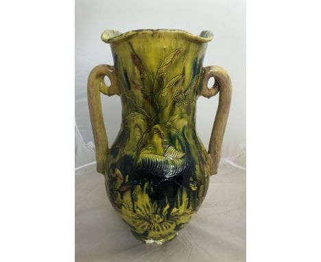 A large 19th century ceramic vase with floral and animal decoration