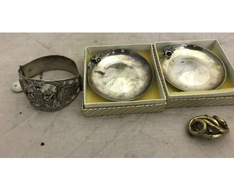 Two silver pin trays together with a bangle