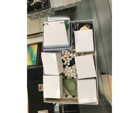 A quantity of jade carvings; together with boxed loupes and pearl necklace