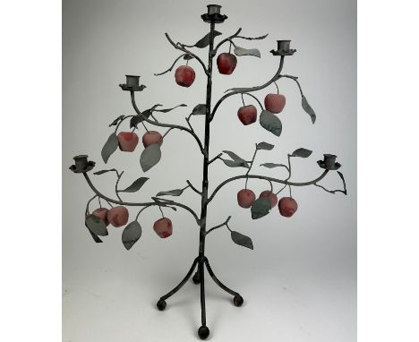 AN UNUSUAL FIVE ARM CANDELABRA IN THE FORM OF A TREE BEARING APPLES AND LEAVES, raised on four sloping legs terminating in ro