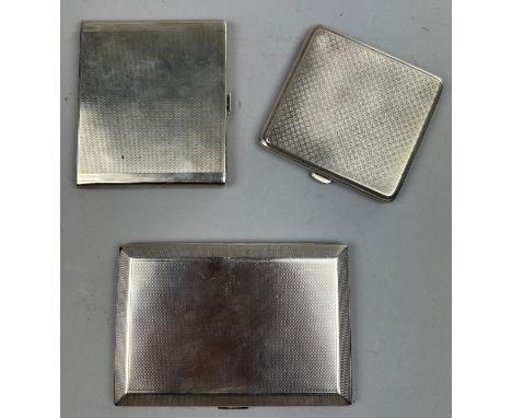 THREE SILVER CIGARETTE CASES, including one larger engine turned by Goldsmiths and Silversmiths Total weight: 430gms