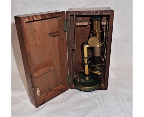 A STUDENTS MICROSCOPE, in a fitted wooden case