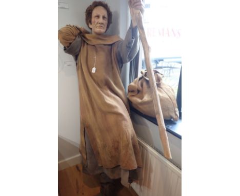 'THE CANTERBURY TALES' A FIBREGLASS STUDY OF 'A KNIGHT'S YEOMAN' with brown cloak and bag, 182cm high, provenance; from 'The 