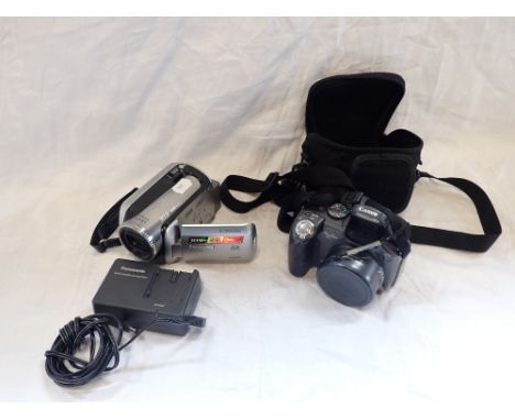 A LEICA DICOMAR CAMERA and a Canon Power shot (2) with a battery charger