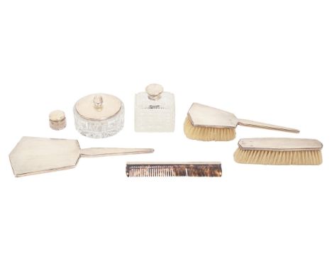 A George V six-piece silver brush set, by Adie Brothers Ltd, Birmingham 1931 and another item (7)  The silver mounted powder 