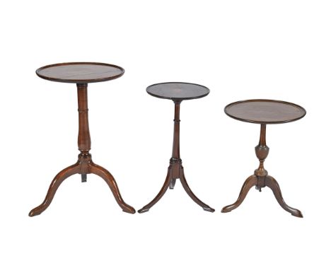 A George III fruitwood tripod table, with dished top, 67cm h; 40cm diam and two smaller mahogany tripod tables of later date 