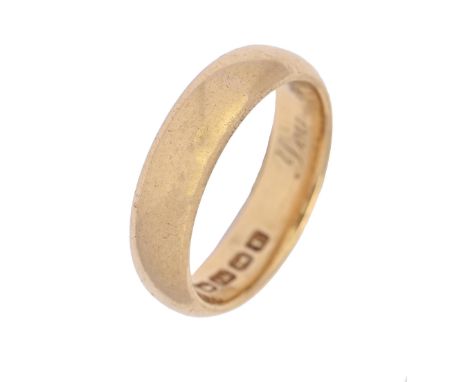 A 22ct gold wedding ring, engraved with a date, Birmingham 1918, 11.2g, size F  Slight wear scratches