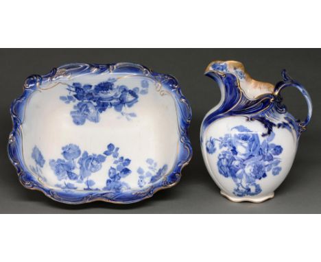 A Royal Doulton flow blue gloire-de-dijon chamber jug and basin, c1910, basin 42cm l, printed mark and Rd number  Good condit