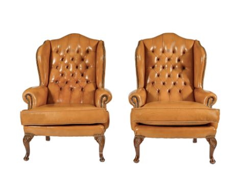 A pair of brass nailed and button hide wing armchairs, late 20th c, in George III style, on cabriole legs  Minor scuff marks 