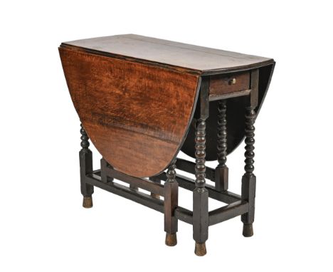An oak gateleg table, c1700, on bobbin turned legs united by stretchers, 72cm h; 90 x 132cm  Hinges of later date, feet repla