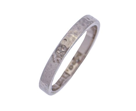 An 18ct white gold textured wedding band, London 1968, 2.7g, size K  Light wear consistent with age