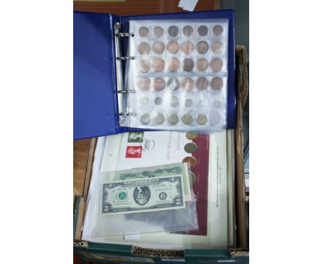 A box of coins, includes an album, coin sets and coin First Day Cover sets and UK, World, Notgeld banknotes