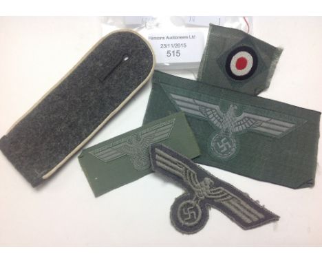 WWII German Army cloth insignia lot:
One Heer Infanterie shoulder strap
Two Heer breast Eagles, one Bevo, one embroidered
Bev