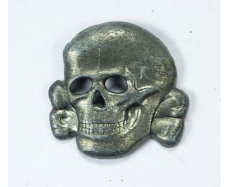 Waffen SS metal cap skull. Late war three prong design.