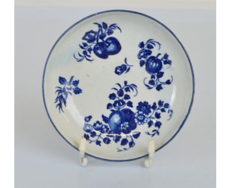 A first period Worcester blue and white circular saucer dish, with fruit and sprig pattern, filled, printed crescent mark to 