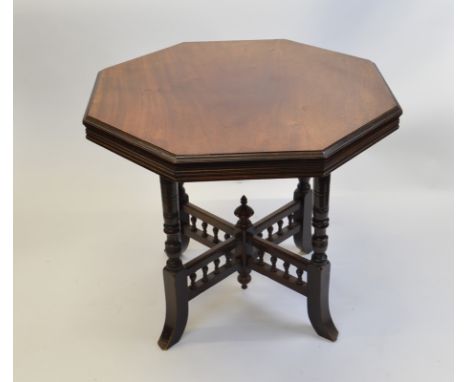 A mahogany octagonal occasional table, having four turned legs on splayed feet with baluster x stretcher with acorn finial, 6