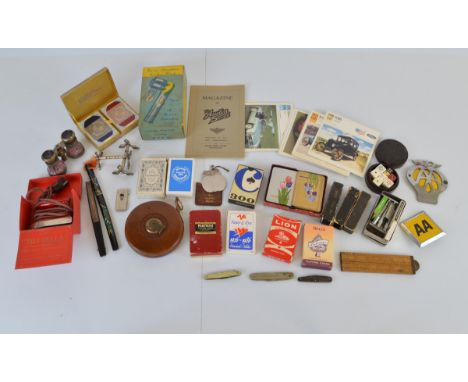 A mixed lot of collectables, including vintage playing card decks and dice sets, Magazine of The Austin Seven, AA car badges,