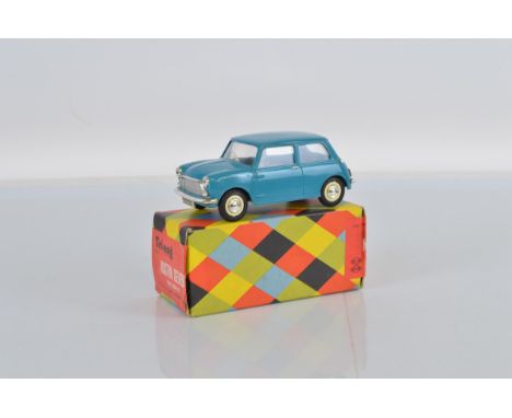 A scarce boxed Tri-ang Minic M020 1/20th scale Austin Seven Mini,  motorised model in blue, with plated parts and generally a