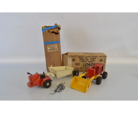 Two boxed vintage Tri-ang Pressed Steel Construction Vehicles from their 'Giant Series', a scarce Earth Hauler in red and cre
