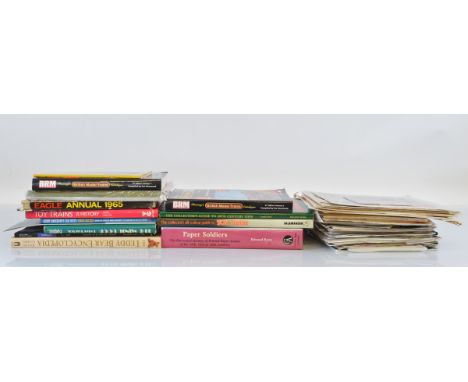A quantity of toy related books and catalogues, including Scalextric, Corgi, Mamod, etc. Together with a collection of comics