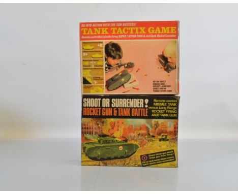 Two boxed versions of the Tri-ang M.310  Rocket Gun and Tank Battle Set, 'Tank Tactix Game' and 'Shoot &amp; Surrender! Rocke