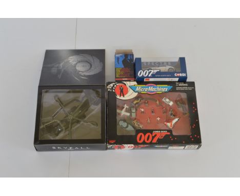 A small collection of James Bond 007 diecast models, including an Italieri Skyfall helicopter, Corgi Spectre DB10, Kyosho Van