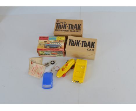 A boxed Tri-ang Frog, the red and yellow plastic model, complete with motor, has been built and appears generally G/G+ althou