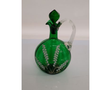 A 19th century Mary Gregory green glass and enamel decanter and stopper, with lily of the valley decoration, 22 cm high 