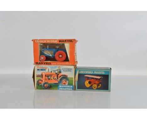 Two boxed vintage Tri-ang  Tractor models including a Minic 211M clockwork powered Nuffield Tractor model, F/G with some sun 