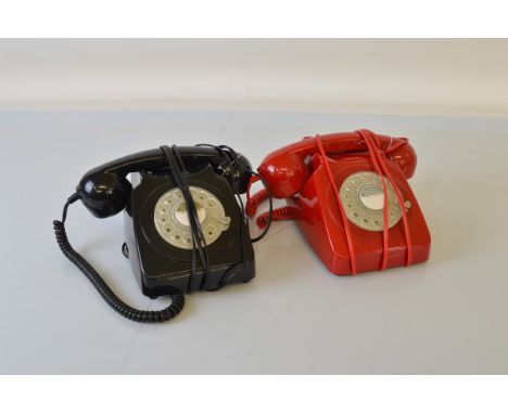 Two modern rotary dial telephones, one in black one in red (2)