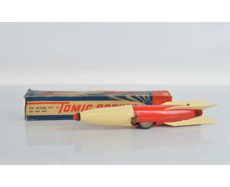 A very scarce boxed 'Tomic Rocket' model, approximately 37cm long, manufactured by International Model Aircraft Ltd., a Tri-a