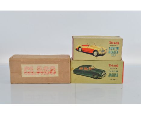 Two boxed Tri-ang Battery Operated Minic Cars in 1/20th  scale,  including an M.004 Jaguar 2.4 in dark red, F-G wth some surf