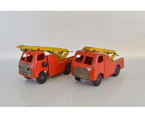 Two unboxed Tri-ang TM6015 Pressed Steel Fire Engine models from their 'Diesel' series, approximately 39cm long. One appears 