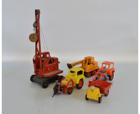 Four unboxed tri-ang Hi-Way Construction vehicles including a 'Scoop-A-Dozer' Trencher, an Articulated Dumper and two JCB Tra