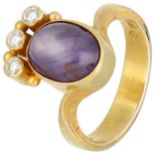 18K yellow gold ring set with a star sapphire and diamonds