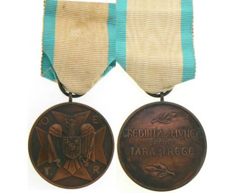 2nd Form, 3rd Class. Breast Badge, 35 mm, Bronze, original suspension ring and ribbon. Instituted on November 14th, 1934, in 