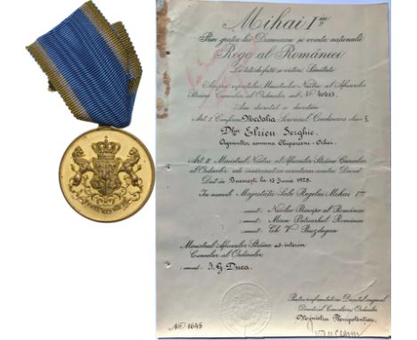 to a Romanian Farmer. Breast Badge, 30 mm, gilt Bronze, original suspension ring and ribbon, together with awarding document,