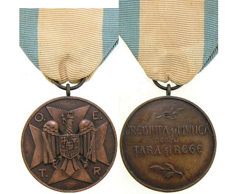 2nd Form, 3rd Class. Breast Badge, 35 mm, Bronze, original suspension ring and ribbon. Instituted on November 14th, 1934, in 