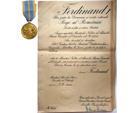  to a Romanian Official . Breast Badge, 30 mm, Bronze gilt, original suspension ring and ribbon, together with awarding docum