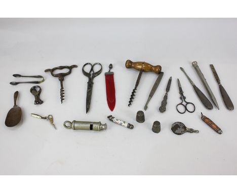 A collection of silver and silver mounted items including thimbles, a propelling pencil, and manicure tools, together with tw