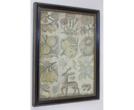 An embroidery panel of a deer and creatures amongst fruit and flowers, in glazed frame, 28cm by 19cm