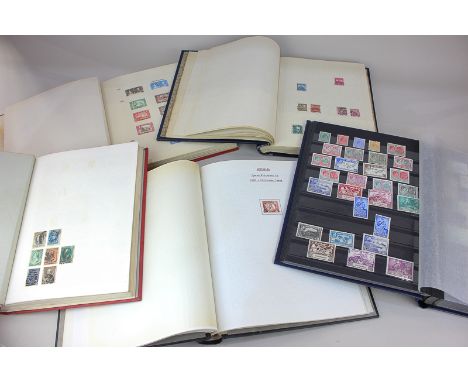 Four postage stamp albums and a stock album of mainly mint pre-1950 Commonwealth stamps