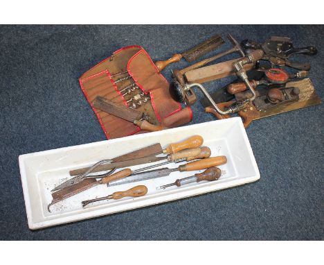 A collection of tools including hand drills, planes, saws and drill bits, makers include Stanley 