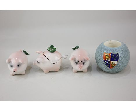 An Italian porcelain cruet set modelled as pigs, together with a Carltonware armorial match strike