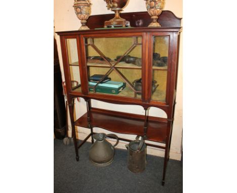 A mahogany display cabinet with panel glazed door enclosing velvet lined interior and shelf, undershelf with acanthus carved 