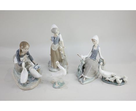 Two Lladro porcelain figures of girls, one with geese, one with a dove, together with a Lladro goose and Lladro group of gees