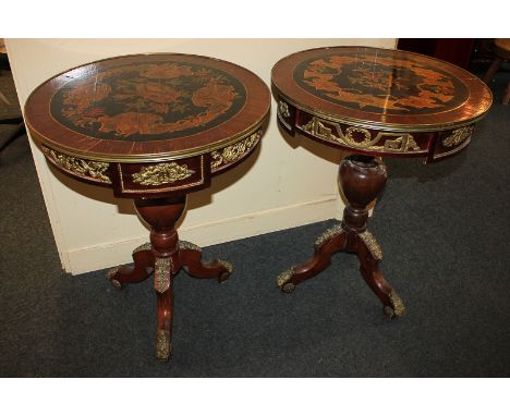 A pair of Continental style gilt metal mounted mahogany circular side tables with painted floral decoration, on baluster stem